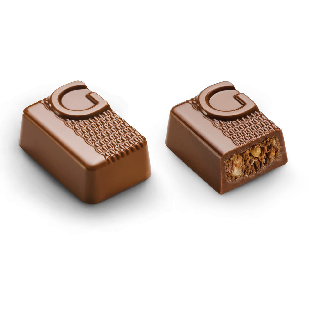 Two Godiva chocolates on a white background