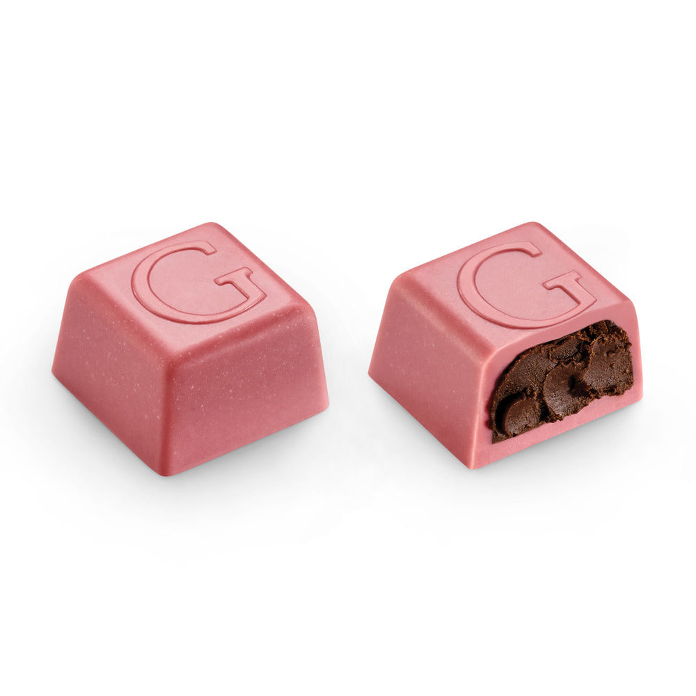 Two Godiva chocolates on a white background