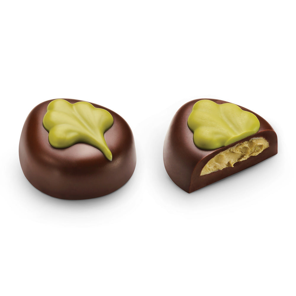 Two Godiva chocolates on a white background