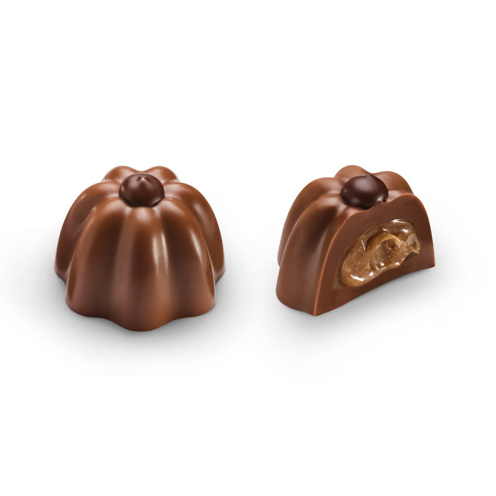 Two Godiva chocolates on a white background