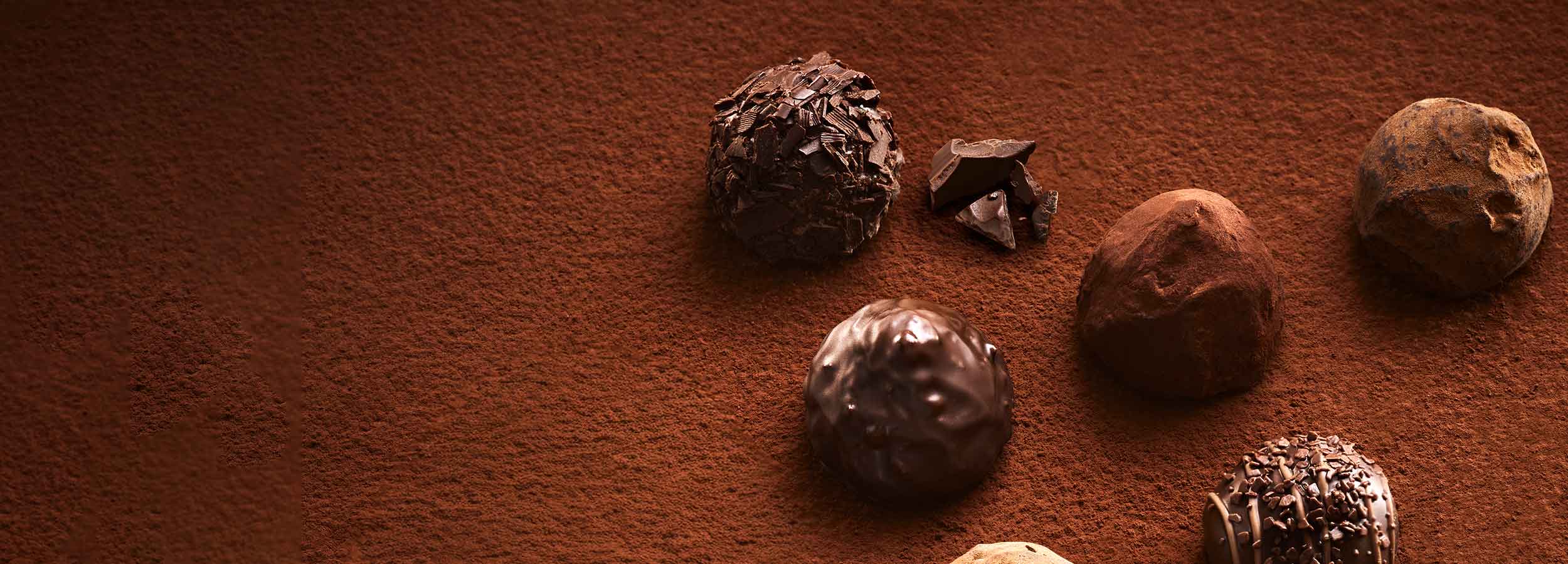 Godiva chocolate truffles on a brown surface